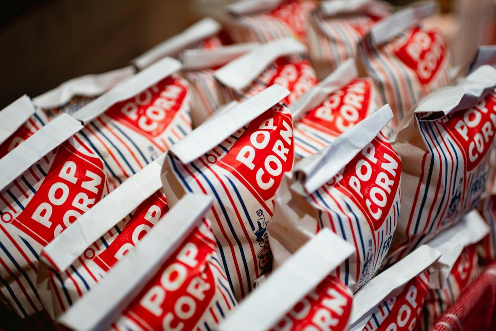 Rows of classic red and white striped popcorn bags