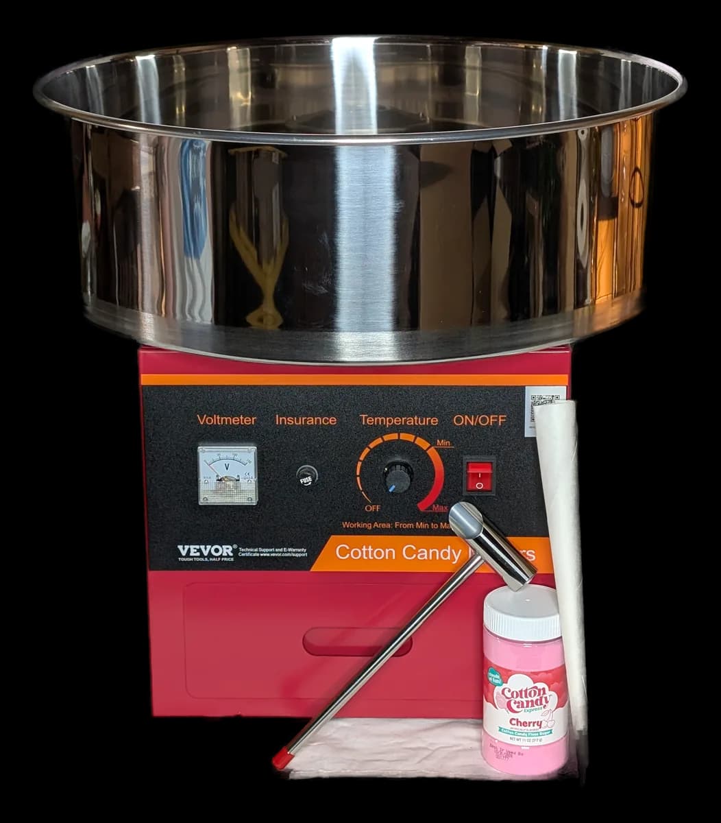 Stainless steel cotton candy machine with a spinning head inside a round bowl